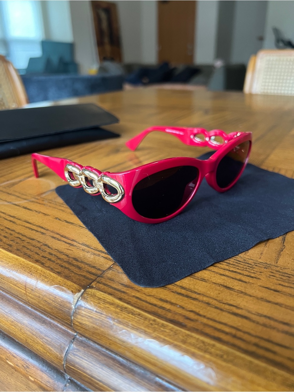 Moschino Red Cat-Eye Sunglasses with Gold Chain Accent